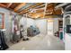 Unfinished basement laundry and utility area with water heater and storage at 6465 Mt Moriah Rd, Nineveh, IN 46164