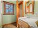 Small bathroom with a vanity, toilet, and a window offering natural light at 6465 Mt Moriah Rd, Nineveh, IN 46164