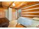 Cozy bedroom with wood walls, twin bed, and ample closet space at 6465 Mt Moriah Rd, Nineveh, IN 46164