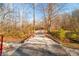 Bridge leading into a wooded area with autumn foliage at 6465 Mt Moriah Rd, Nineveh, IN 46164