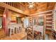 Rustic dining room featuring wood floors and access to a back deck at 6465 Mt Moriah Rd, Nineveh, IN 46164