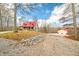 Log cabin home with red metal roof, porch, and detached garage at 6465 Mt Moriah Rd, Nineveh, IN 46164