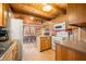 Open kitchen with island, wood cabinets and view of dining area at 6465 Mt Moriah Rd, Nineveh, IN 46164