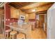 Cozy kitchen with wood cabinets and a breakfast bar at 6465 Mt Moriah Rd, Nineveh, IN 46164