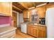 Fully equipped kitchen with wood cabinets and a double sink at 6465 Mt Moriah Rd, Nineveh, IN 46164