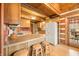 Bright kitchen featuring wood cabinets and a view of the deck at 6465 Mt Moriah Rd, Nineveh, IN 46164