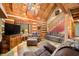 Living room with high ceilings, log walls and comfy seating at 6465 Mt Moriah Rd, Nineveh, IN 46164