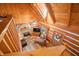 Open living room with stone fireplace and vaulted wood ceilings at 6465 Mt Moriah Rd, Nineveh, IN 46164