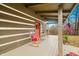 Spacious front porch with rocking chairs and fall decor at 6465 Mt Moriah Rd, Nineveh, IN 46164
