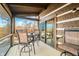 Relaxing screened porch with wooden deck and wooded views at 6465 Mt Moriah Rd, Nineveh, IN 46164