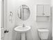 Clean bathroom with pedestal sink, toilet, and a small medicine cabinet at 1782 N Clearwater Dr, Greenfield, IN 46140