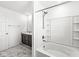 Bathroom with shower/tub combo, dark brown vanity, and marble flooring at 1782 N Clearwater Dr, Greenfield, IN 46140