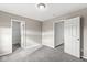 Spacious bedroom featuring grey carpet and ample closet space at 1782 N Clearwater Dr, Greenfield, IN 46140
