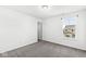 Well-lit bedroom with grey carpet and an adjacent closet at 1782 N Clearwater Dr, Greenfield, IN 46140