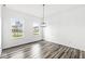 Empty dining room with hardwood floors and large windows at 1782 N Clearwater Dr, Greenfield, IN 46140