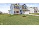 Landscaped lawn with a two-story home in the background at 1782 N Clearwater Dr, Greenfield, IN 46140