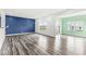 Open living area with hardwood floors and blue accent wall at 1782 N Clearwater Dr, Greenfield, IN 46140