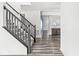 Modern staircase with dark wood railings leading to the second floor at 1782 N Clearwater Dr, Greenfield, IN 46140