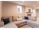 Comfortable basement lounge area with sectional sofa and plush pillows at 2355 W State Road 234, Fortville, IN 46040