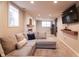 Open concept basement with sectional sofa, electric fireplace, and built-in shelving at 2355 W State Road 234, Fortville, IN 46040