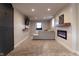 Finished basement with electric fireplace and sitting area at 2355 W State Road 234, Fortville, IN 46040