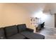 Finished basement featuring a sectional sofa and home office area at 2355 W State Road 234, Fortville, IN 46040