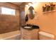 Clean bathroom with updated vanity, tile surround and flooring at 2355 W State Road 234, Fortville, IN 46040