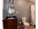 Clean bathroom with dark vanity, updated toilet and shower at 2355 W State Road 234, Fortville, IN 46040