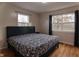 Spacious bedroom with hardwood floors and large windows at 2355 W State Road 234, Fortville, IN 46040