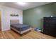 bedroom with hardwood floors and an accent wall at 2355 W State Road 234, Fortville, IN 46040