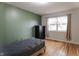 Cozy bedroom with hardwood floors and an accent wall at 2355 W State Road 234, Fortville, IN 46040