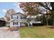 Two story house with gray siding, deck, and American flag at 2355 W State Road 234, Fortville, IN 46040