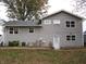 Rear view of a two story home with gray siding and multiple windows at 2355 W State Road 234, Fortville, IN 46040