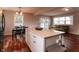 Open concept kitchen with island and adjacent living area at 2355 W State Road 234, Fortville, IN 46040