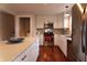 Modern kitchen featuring white cabinets, stainless steel appliances, and hardwood floors at 2355 W State Road 234, Fortville, IN 46040