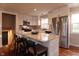 Modern kitchen with white cabinets, stainless steel appliances, and an island at 2355 W State Road 234, Fortville, IN 46040