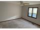 Simple bedroom with ceiling fan, window with blinds, and neutral wall color at 4256 Bending Ln, Greenwood, IN 46143