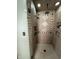 Large walk-in shower with tile surround, dual shower heads, and built-in shelves at 4256 Bending Ln, Greenwood, IN 46143