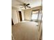 Carpeted bedroom with double closets and ceiling fan at 4835 Franklin Villas Dr, Indianapolis, IN 46237