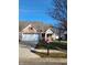 Brick ranch home with two-car garage and landscaped yard at 4835 Franklin Villas Dr, Indianapolis, IN 46237