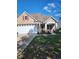 Brick ranch home with two-car garage and landscaped lawn at 4835 Franklin Villas Dr, Indianapolis, IN 46237