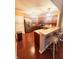 Modern kitchen with wood cabinets and breakfast bar at 4835 Franklin Villas Dr, Indianapolis, IN 46237