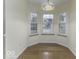 Bright breakfast nook with bay window and stained glass light fixture at 8520 Bison Woods Ct, Indianapolis, IN 46227
