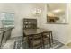 Dining area with chandelier, hutch, and four-seat table at 8520 Bison Woods Ct, Indianapolis, IN 46227