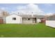 Spacious backyard, grassy lawn, and covered patio at 8530 Meadowlark Dr, Indianapolis, IN 46226