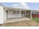 Backyard patio with brick flooring and covered seating area at 8530 Meadowlark Dr, Indianapolis, IN 46226