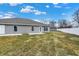 Gray house with backyard patio and grassy lawn at 1501 Coen Ct, Columbus, IN 47201