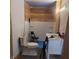 Under construction bathroom with toilet, shower, vanity, and wood accent wall at 2845 Forest Manor Ave, Indianapolis, IN 46218