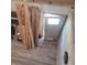 Unfinished interior showing wooden beams, exposed wires, and construction materials at 2845 Forest Manor Ave, Indianapolis, IN 46218