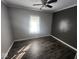 Second bedroom with hardwood floors and a window at 306 E Cherry St, Advance, IN 46102